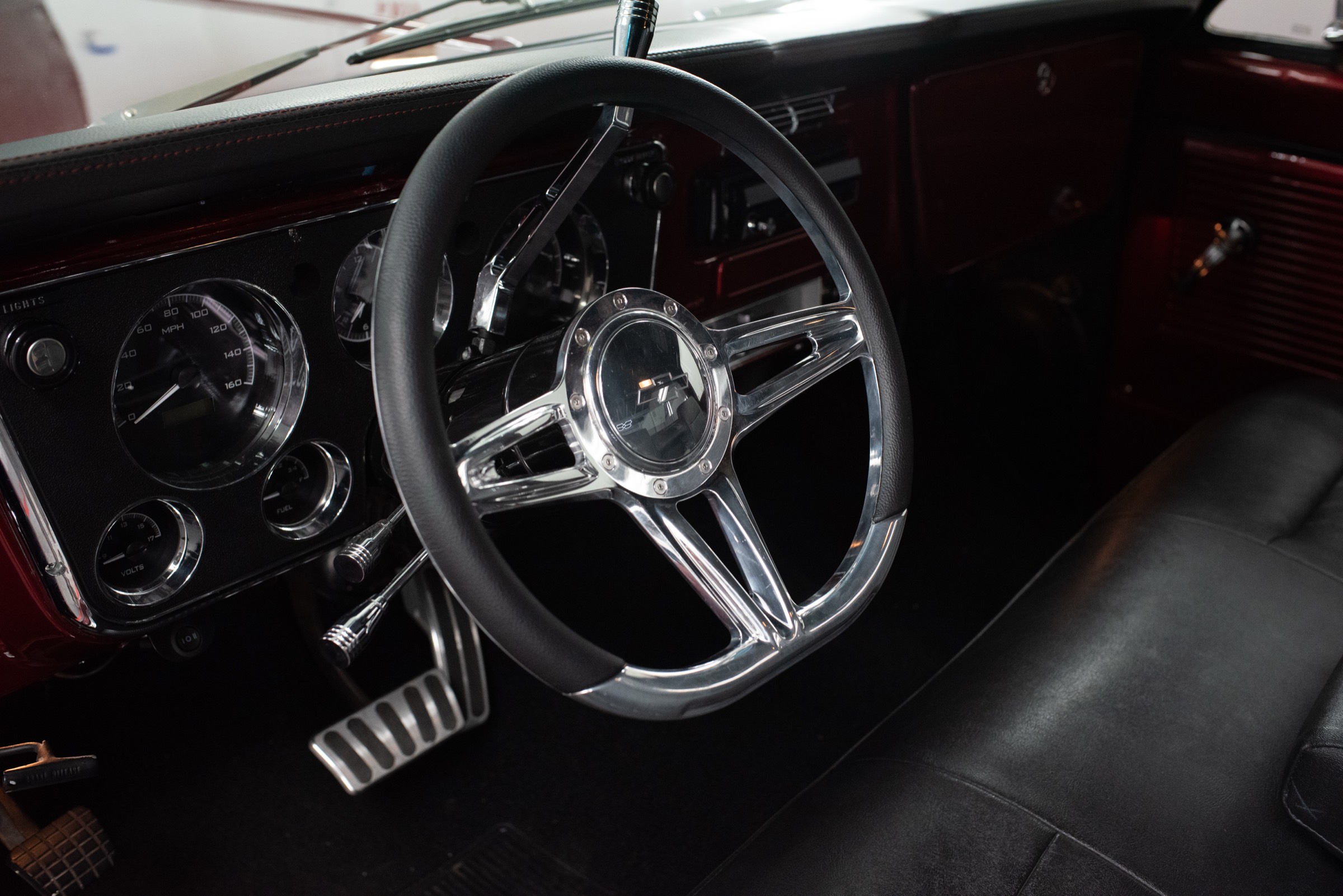 1970 Chevrolet C10 Stepside black bench-seat interior with Dakota Digital gauges — Morgan Muscle Cars in Pelham, Alabama