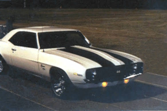 White Chevrolet Camaro with black racing stripes at the drag strip — Morgan Muscle Cars, Pelham, Alabama.